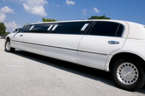 White Stretch limousine waiting for guests to arrive